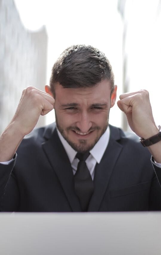 Man in Black Suit Achieved an Accomplishment